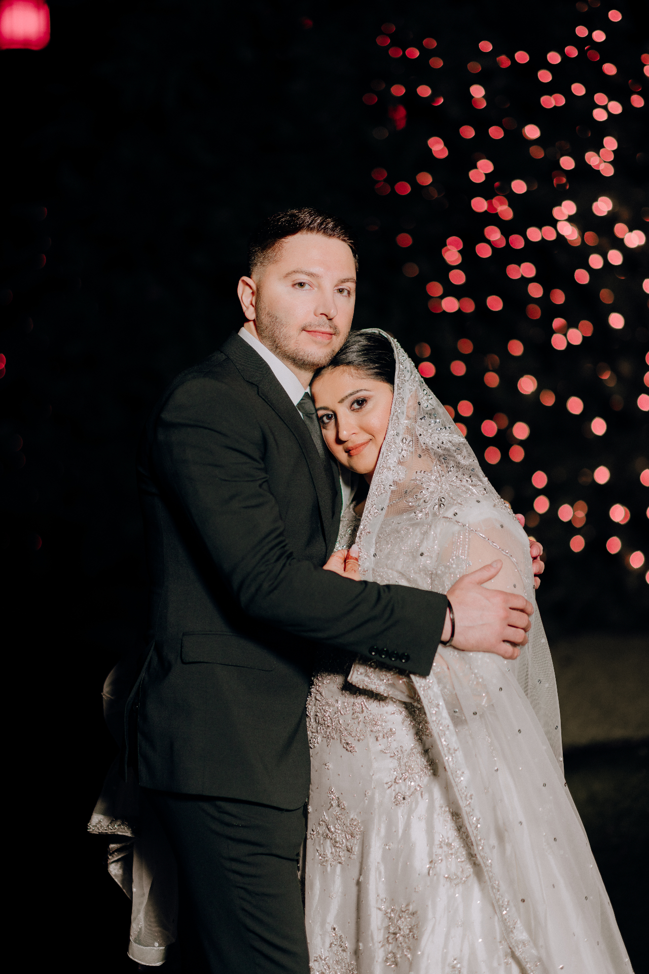 A couple embracing at their wedding
